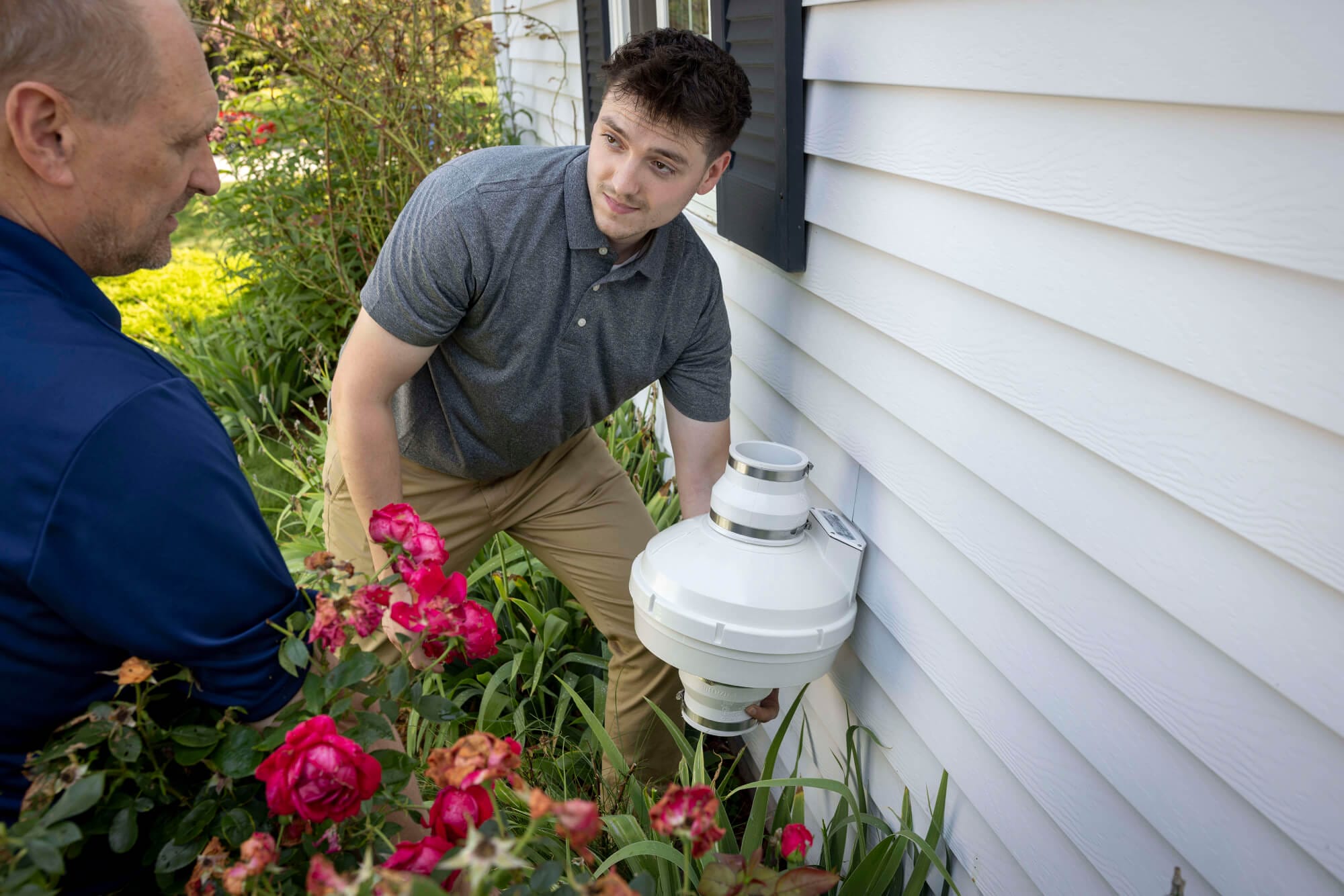 Radon mitigation system installation by technician
