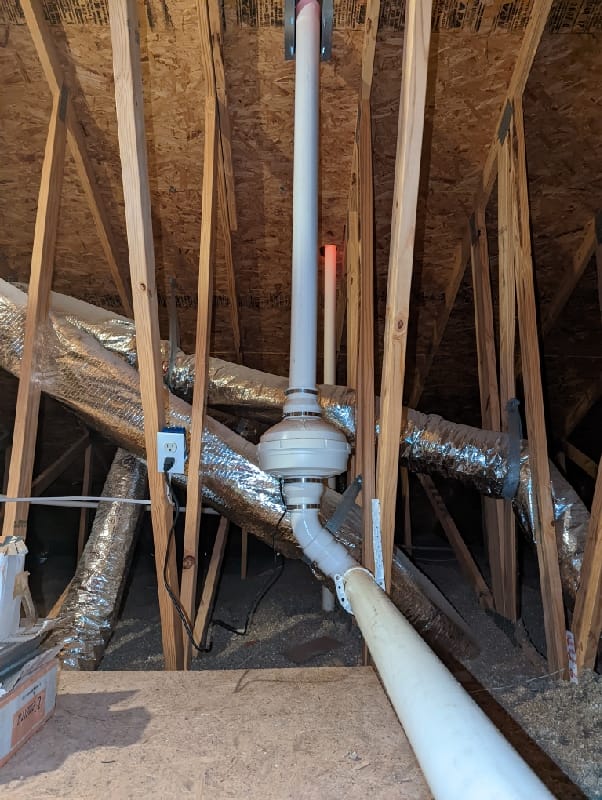 Radon Mitigation System Installed in Residential Attic
